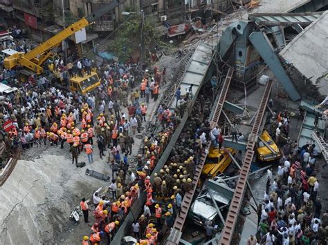 Construction platform at railroad bridge being built in India collapses, killing at least 26 workers